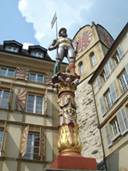 Statue above a fountain in the old town of Neuch�tel